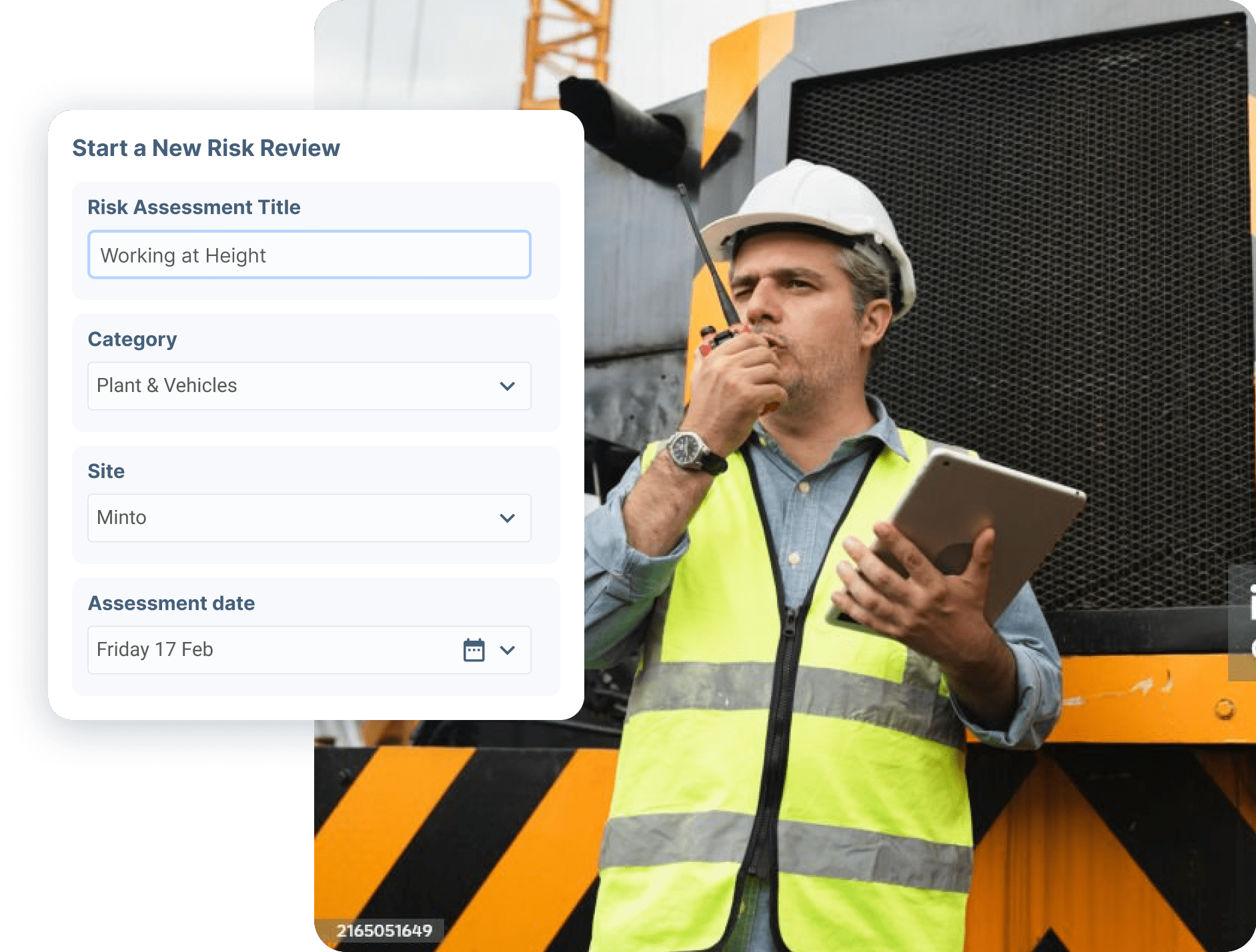 Construction supervisor with radio using risk assessment form on construction site